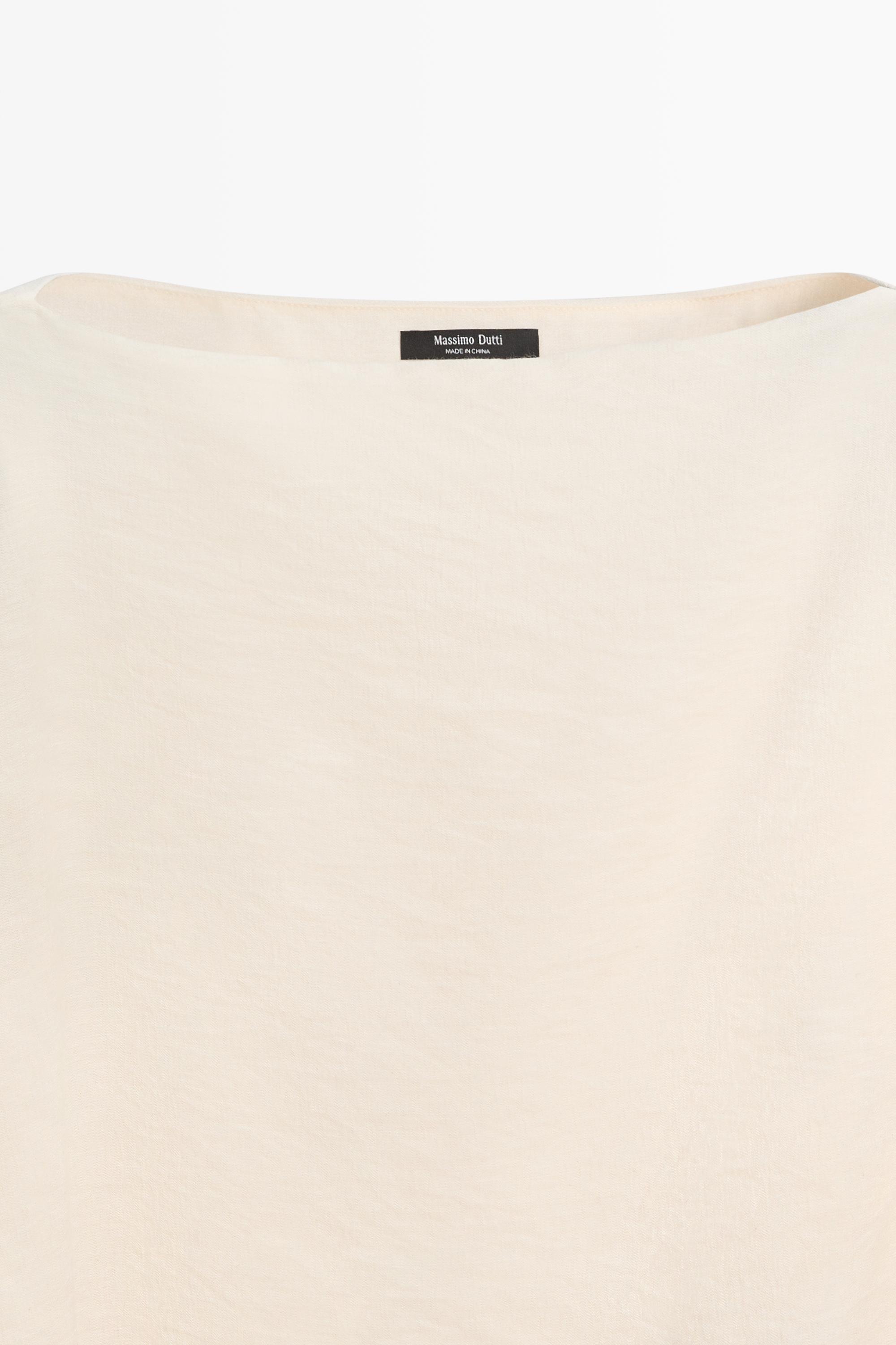 Blouse fluide asymétrique style cape